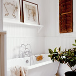 Classic white bathroom + striped wallpaper + wood accents