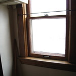 East facing window inside the kitchen pantry
