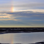 A sun dog shimmers in the morning light