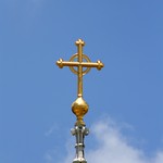 Golden Cross Pointing Upward