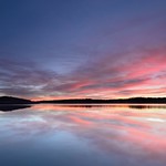 Horizon clouds and water reflections