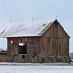 half a barn in snow