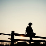a fence and a sunset
