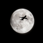 British Airways A320 passing an almost full super moon-1