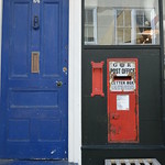old post box and blue door