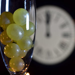 CELEBRATION OF THE NEW YEAR, TRADITION OF TWELVE GRAPES OF LUCK WITH THE CLOCK WITH TWELVE BELLS