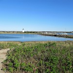 Pond and distant view to Edgartown Harbor Light, Edgartown, Massachusetts
