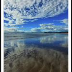 BLUE SKIES AND CLOUD REFLECTIONS