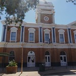 Port Augusta. The classical style Town Hall opened in 1887 with electricity. Now an apartment hotel. At the top of Spencers Gulf.