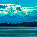 The Blue Hour. The mercurial mountains of Skye from Loch Carron nearing sunset in summer, Wester Ross, Scotland.