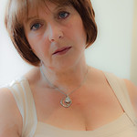 Elderly Woman Behind The Counter in a Small Town