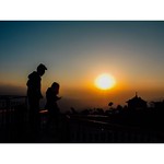 First ray of sun Travels to the earth From high skies Light of day begins to shine Sun rises slowly, far in the sky Goes higher and higher As time trickles Mountains are the first To see the rising beauty Sky is full with rainbow colors Dark shades