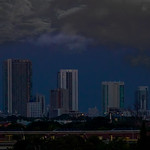 The early moon over Midtown Miami.