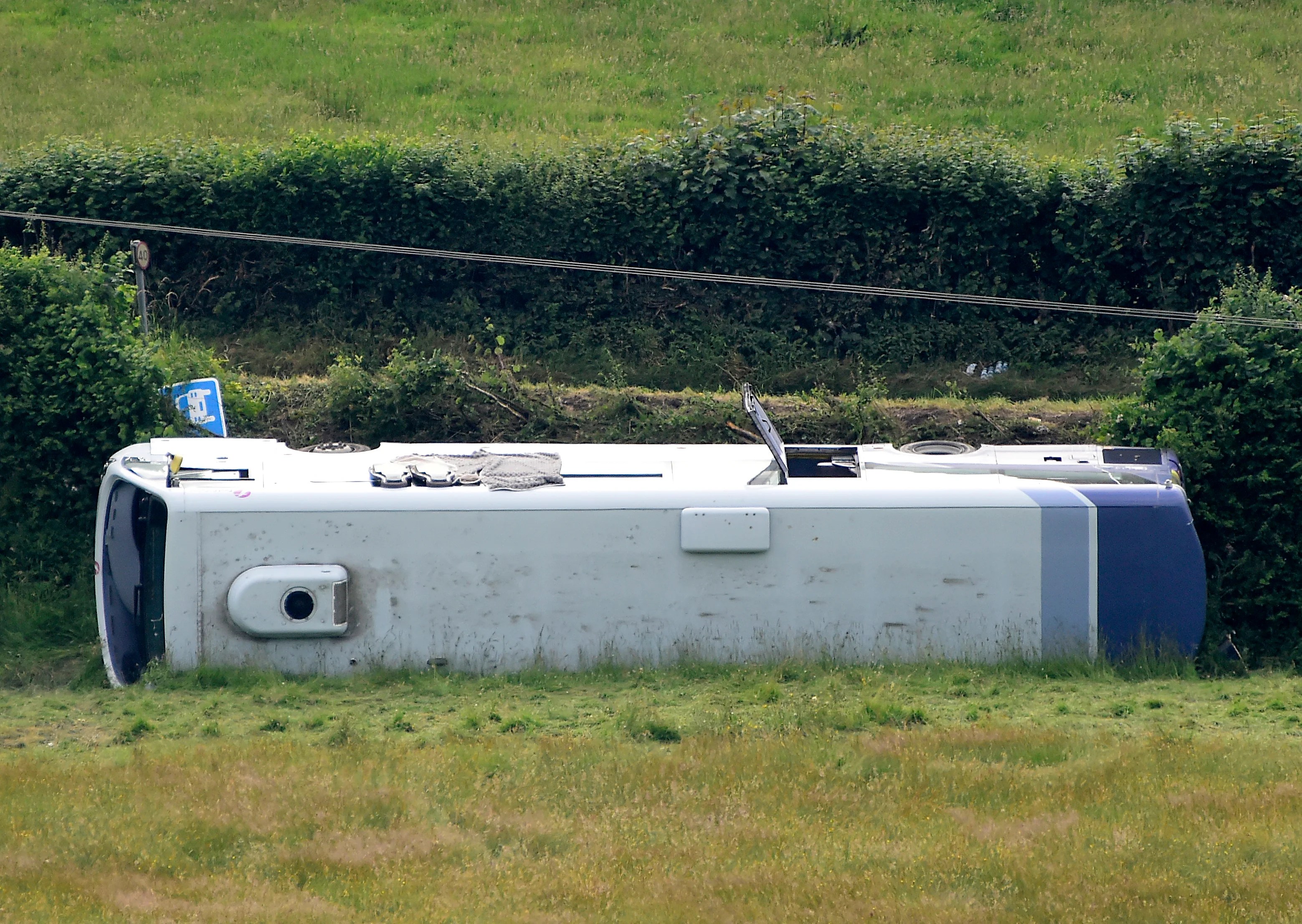 19 injured after bus crash at roundabout in Wales