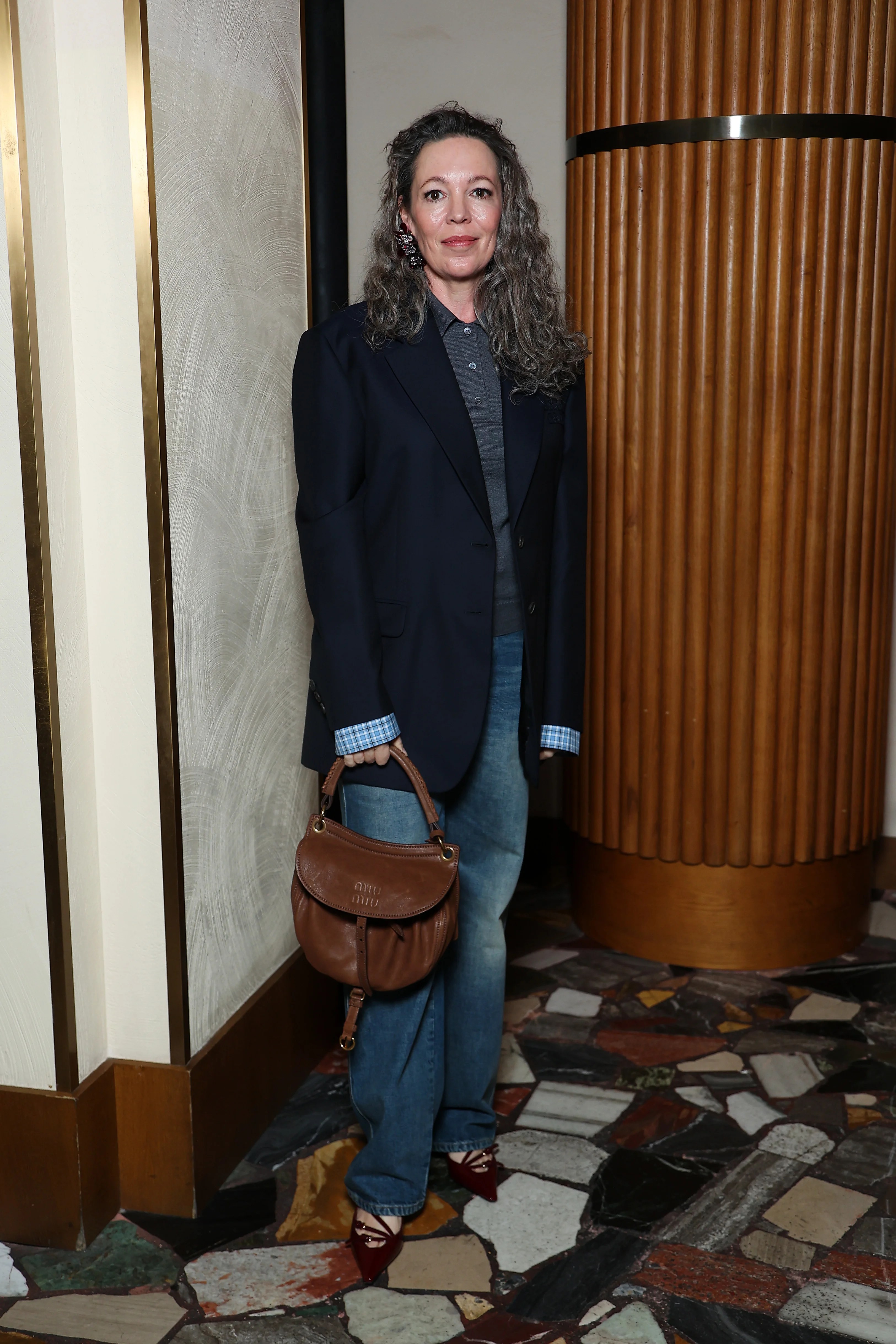 Olivia Colman surprises as Miu Miu model at Paris Fashion Week
