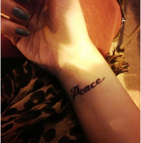 15 Best Peace Tattoo Designs To Enhance Your Beauty 455_x_450_jpg