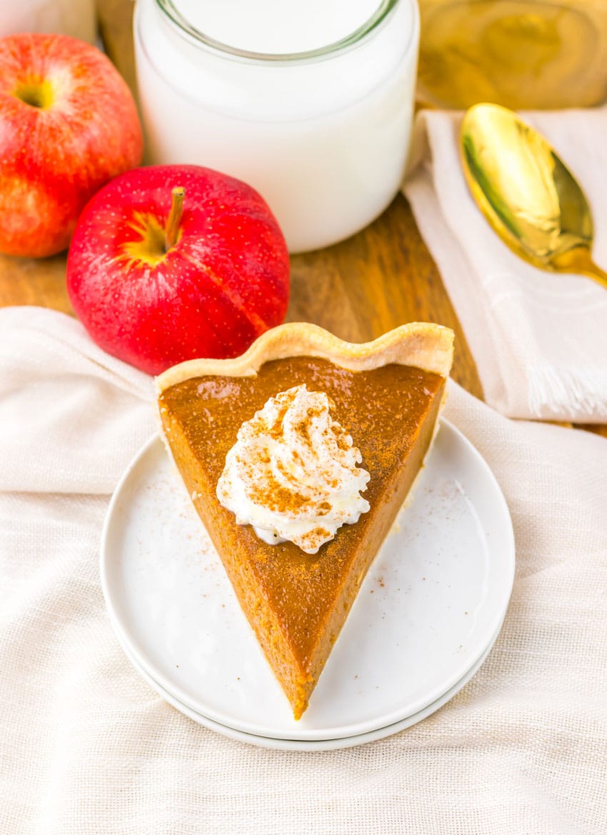 a slice of apple butter pie on a small white dessert plate