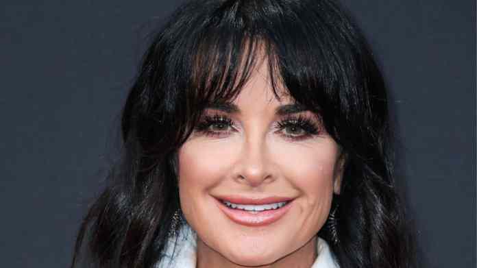Kyle Richards stuns in fitted robe, considers throwing one other white get together for RHOBH