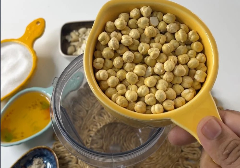 add roasted gram dal in a blender