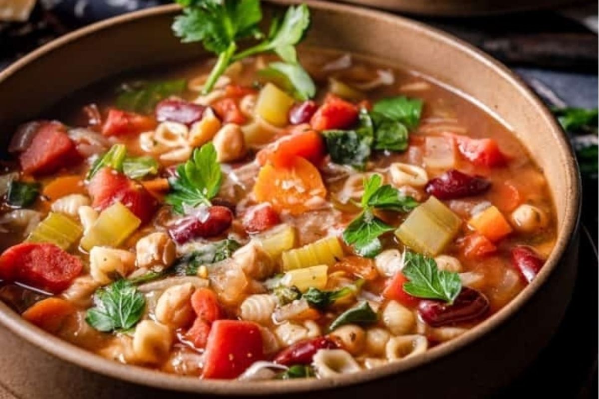 A table showcasing a delectable bowl of bean and vegetable soup.