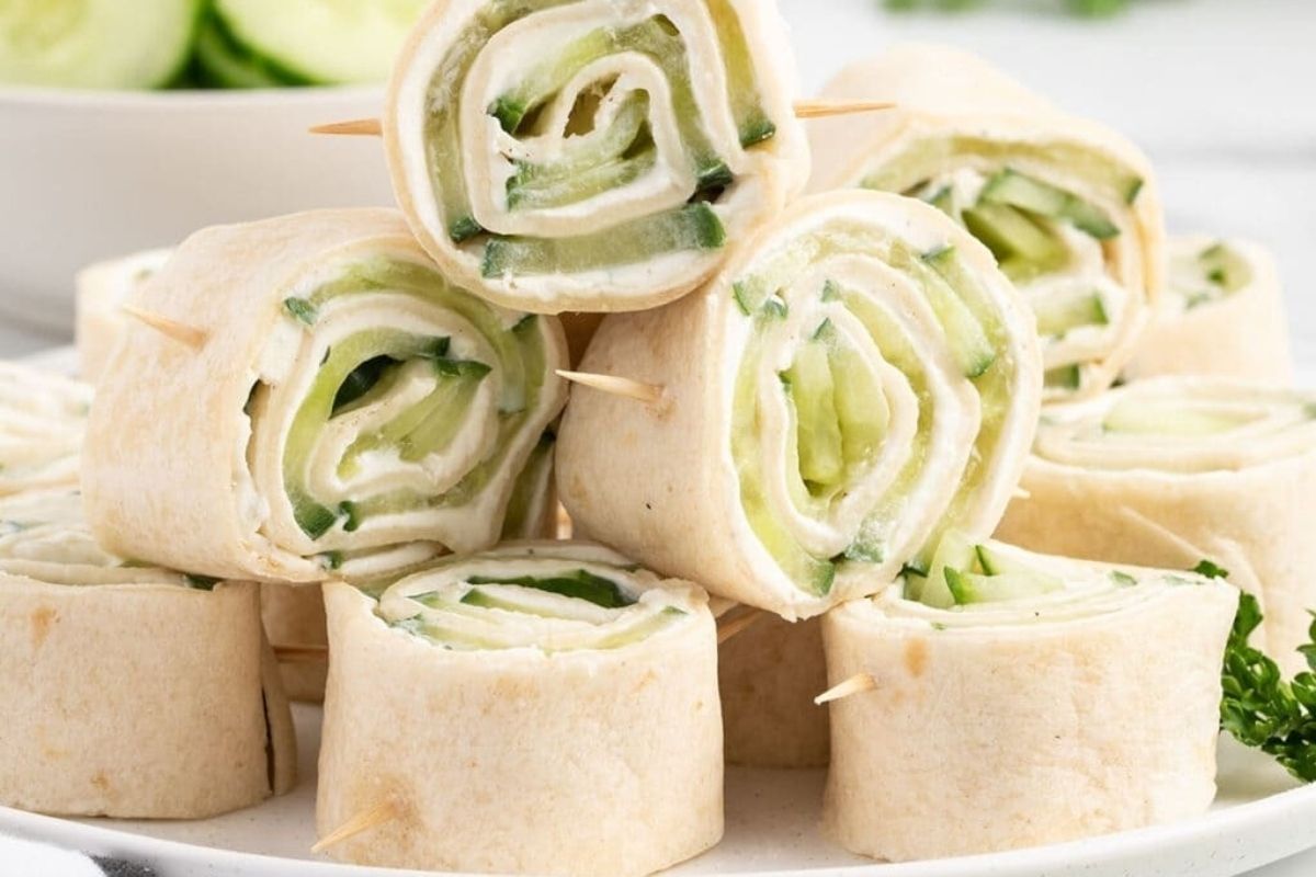 Cold cucumber roll ups on a plate.